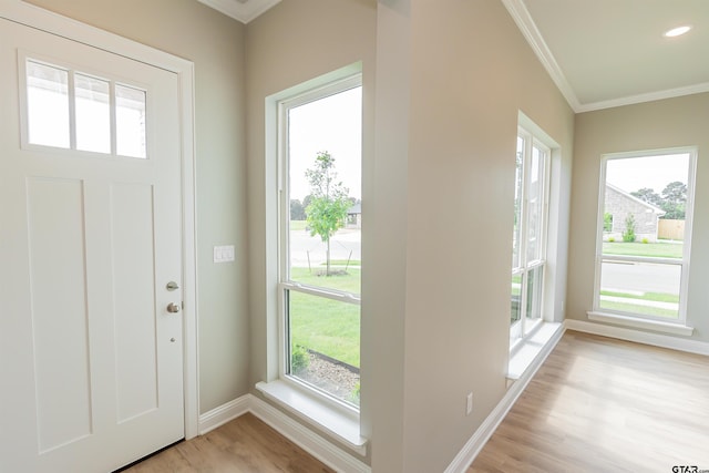 414 Bluebonnet Cir, Chandler, TX 75758 - entryway featuring ornamental molding, light wood finished floors, baseboards, and plenty of natural light