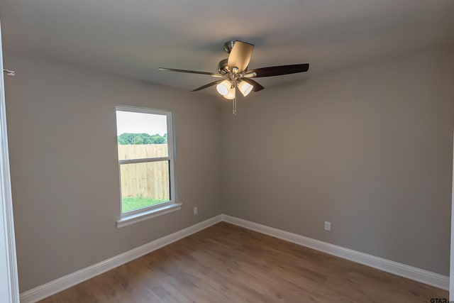 414 Bluebonnet Cir, Chandler, TX 75758 - empty room featuring ceiling fan, wood finished floors, and baseboards