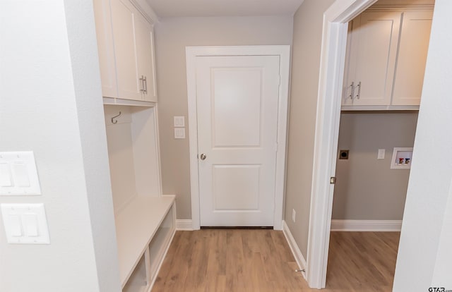 414 Bluebonnet Cir, Chandler, TX 75758 - mudroom featuring light wood-style floors and baseboards