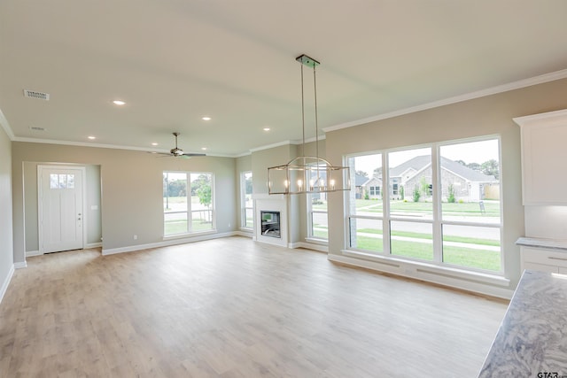 414 Bluebonnet Cir, Chandler, TX 75758 - unfurnished living room with light wood-type flooring, ornamental molding, baseboards, recessed lighting, and ceiling fan