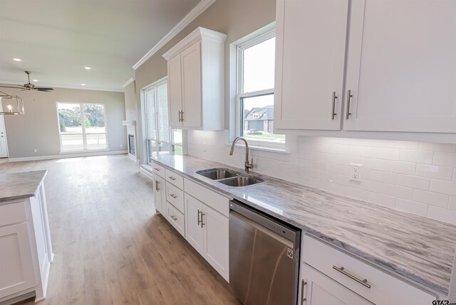 414 Bluebonnet Cir, Chandler, TX 75758 - kitchen featuring dishwasher, a sink, crown molding, white cabinetry, and ceiling fan