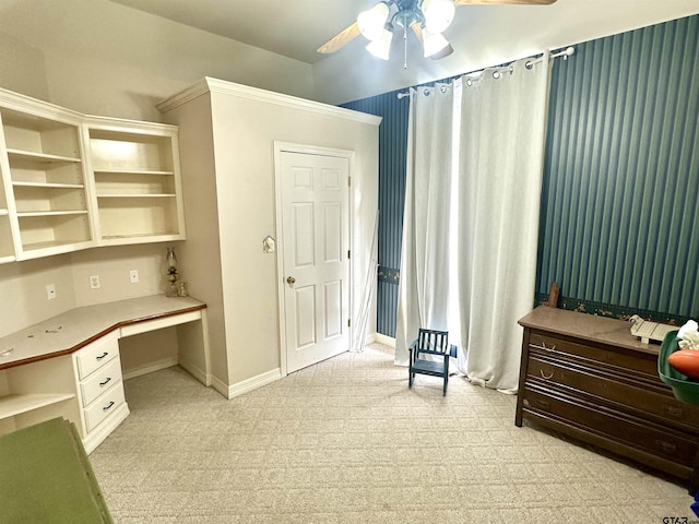 office space featuring ceiling fan, built in study area, and baseboards