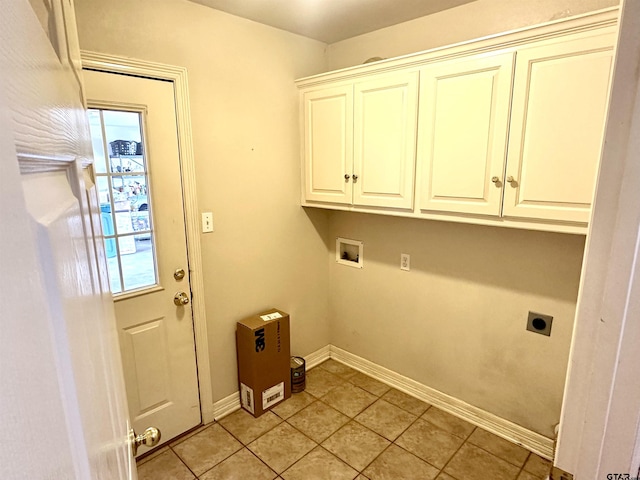 laundry area featuring cabinet space, plenty of natural light, electric dryer hookup, and baseboards