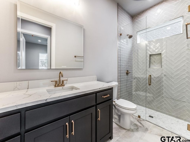 bathroom featuring walk in shower, vanity, and toilet