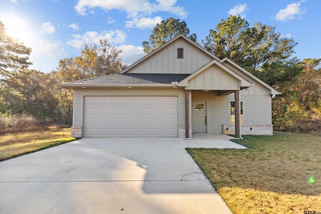 view of front of home featuring a garage and a front lawn