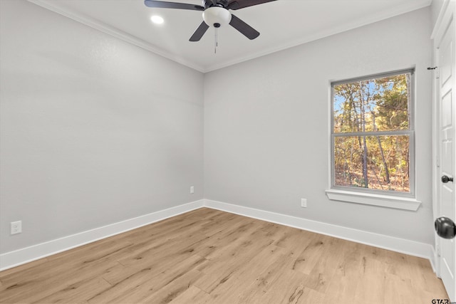 empty room with ceiling fan, ornamental molding, and light wood-type flooring