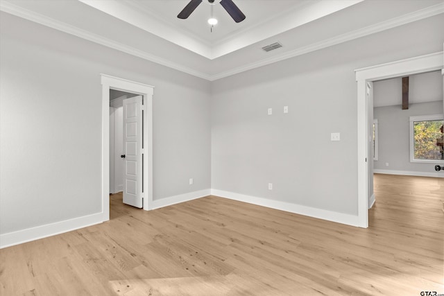 spare room featuring crown molding, ceiling fan, and light hardwood / wood-style floors