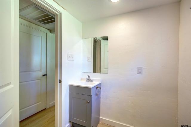 bathroom featuring vanity and wood-type flooring