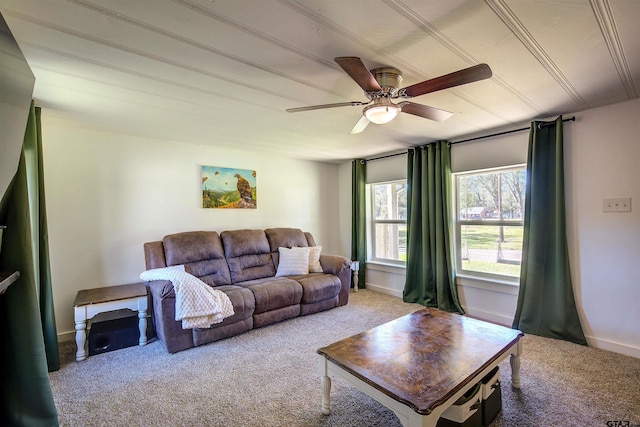 living room with ceiling fan and carpet