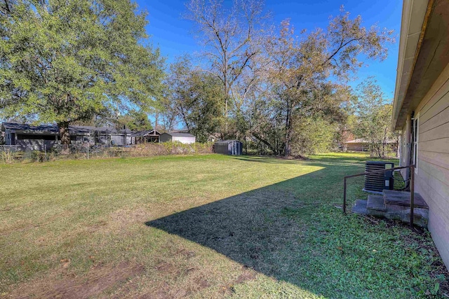 view of yard with central AC