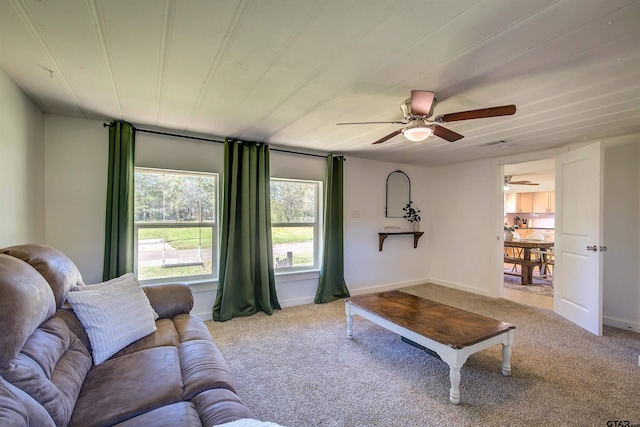 living room with ceiling fan and light colored carpet