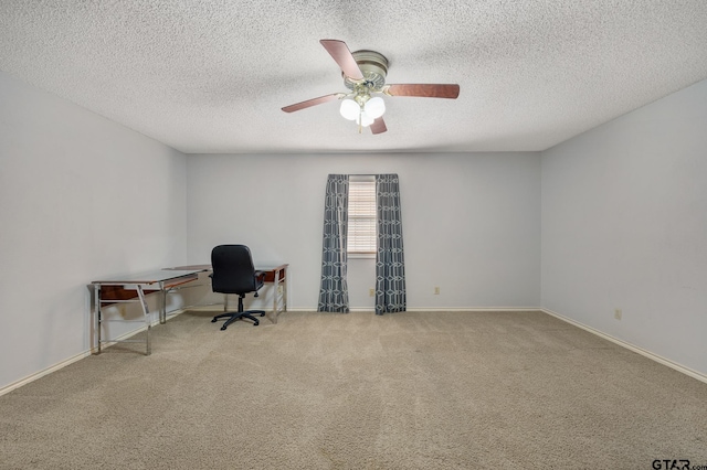 unfurnished office featuring light carpet and a textured ceiling