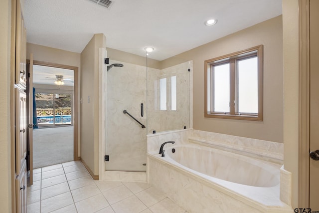 bathroom with tile patterned floors, a wealth of natural light, a textured ceiling, and shower with separate bathtub