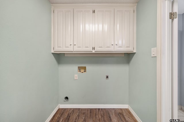 washroom featuring hardwood / wood-style flooring, electric dryer hookup, cabinets, and hookup for a washing machine