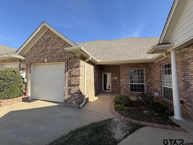 single story home with a garage