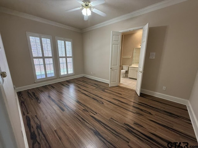 unfurnished bedroom with crown molding, ceiling fan, connected bathroom, and hardwood / wood-style floors