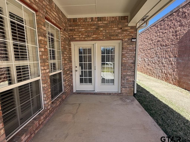 property entrance featuring a patio