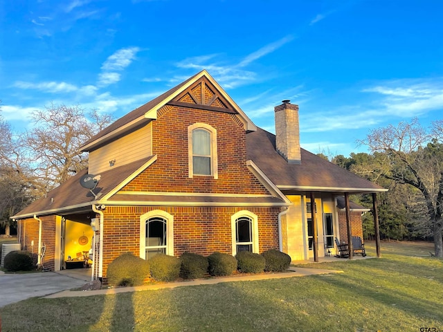 102 Acr 3192, Frankston, TX 75763 - traditional-style house featuring a shingled roof, a front lawn, a chimney, and brick siding