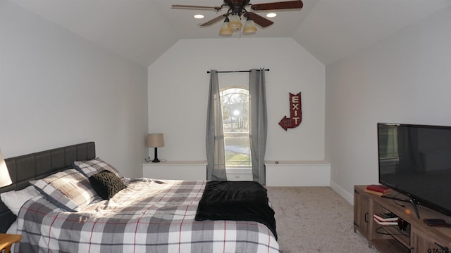 carpeted bedroom featuring vaulted ceiling and ceiling fan