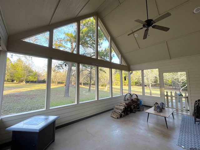 sunroom / solarium with ceiling fan and lofted ceiling