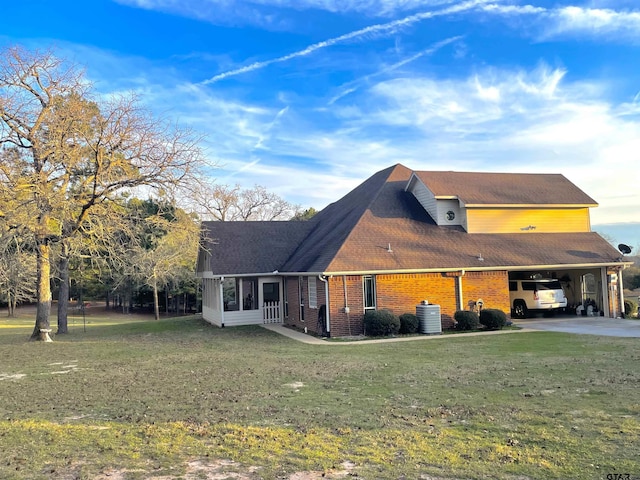 102 Acr 3192, Frankston, TX 75763 - view of home's exterior featuring a yard, a carport, brick siding, and driveway