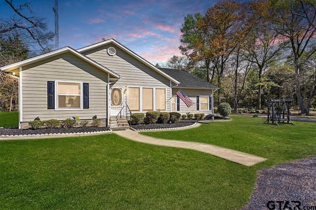 view of front of house with a yard