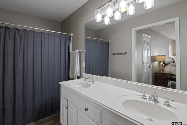 bathroom featuring double vanity and a sink