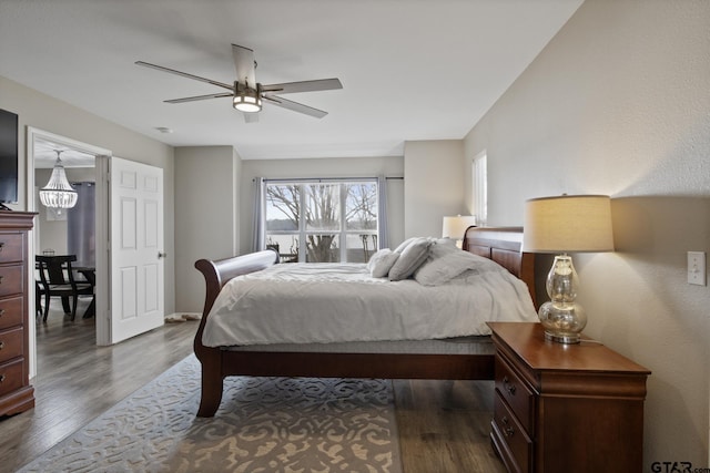 bedroom with dark wood-style flooring and a ceiling fan