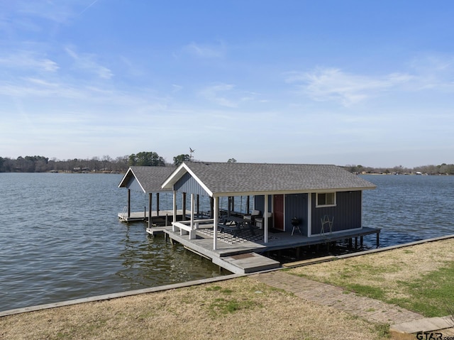 view of dock with a water view and boat lift