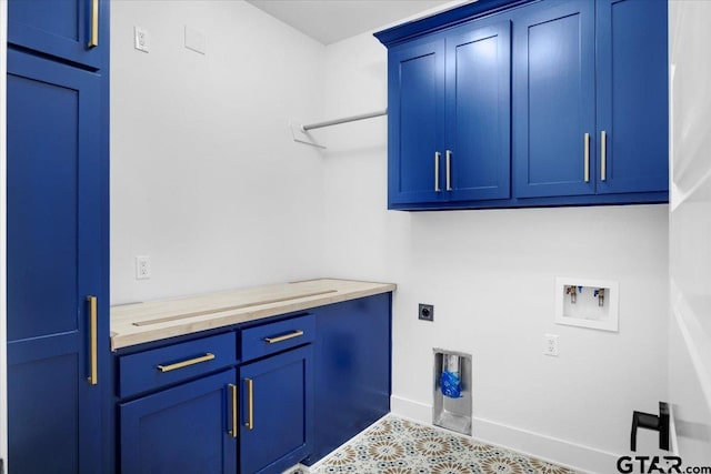 washroom with washer hookup, cabinet space, electric dryer hookup, and baseboards