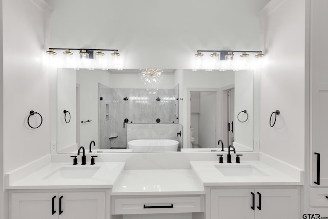 full bathroom with toilet, an inviting chandelier, separate shower and tub, and vanity