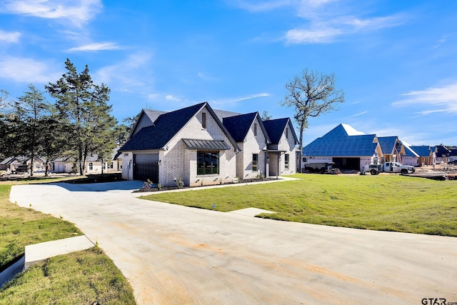 view of front facade with a front lawn and a garage