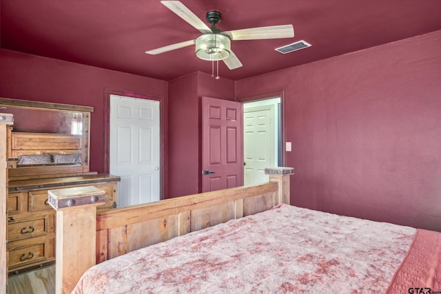 bedroom with visible vents and a ceiling fan