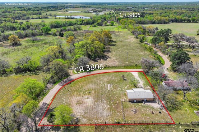 drone / aerial view with a water view and a rural view