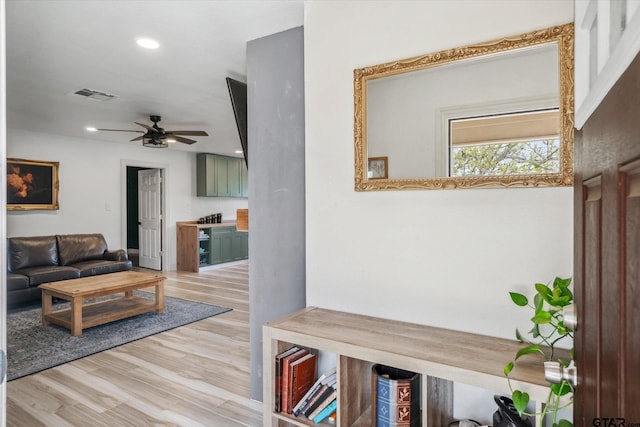 living room with a ceiling fan, light wood-style flooring, recessed lighting, and visible vents