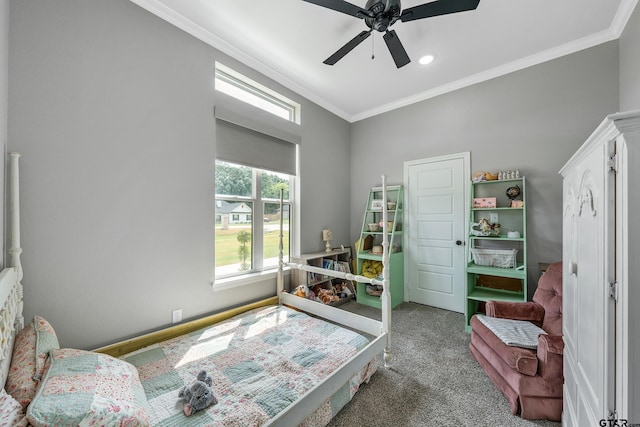 bedroom featuring carpet, ceiling fan, and crown molding