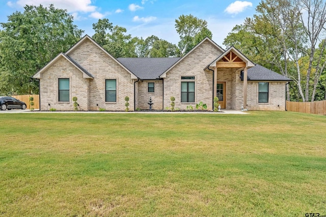 craftsman inspired home with a front lawn