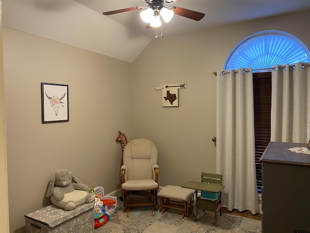 interior space featuring lofted ceiling and ceiling fan