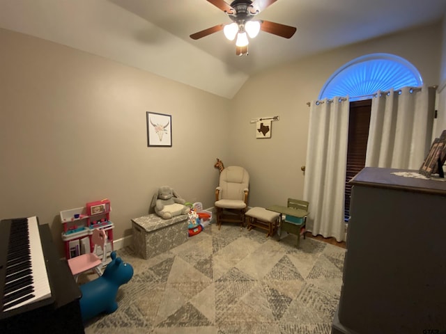 recreation room featuring vaulted ceiling and ceiling fan