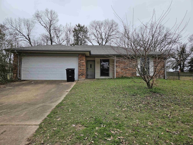 view of front facade featuring a front yard, concrete driveway, brick siding, and an attached garage