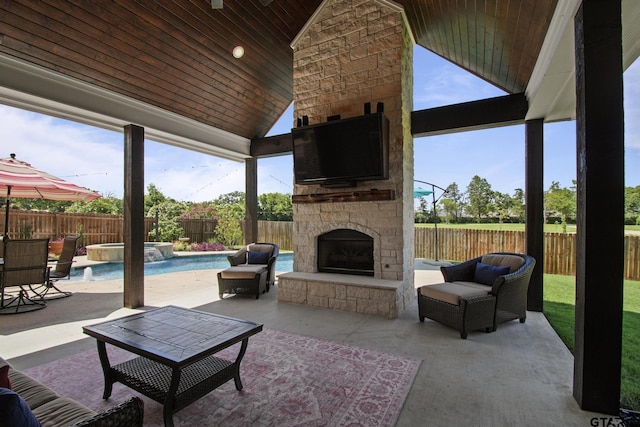 109 Nathan, Chandler, TX 75758 - fenced backyard with a patio area, an outdoor living space with a fireplace, and a pool with connected hot tub
