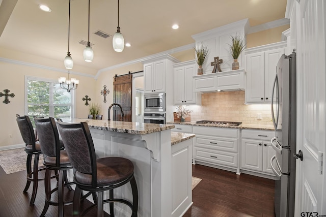 109 Nathan, Chandler, TX 75758 - kitchen with appliances with stainless steel finishes, crown molding, decorative backsplash, white cabinets, and recessed lighting