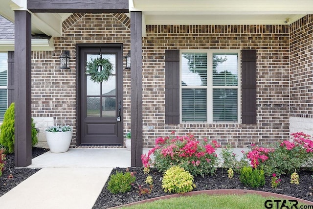 109 Nathan, Chandler, TX 75758 - view of exterior entry with brick siding and covered porch