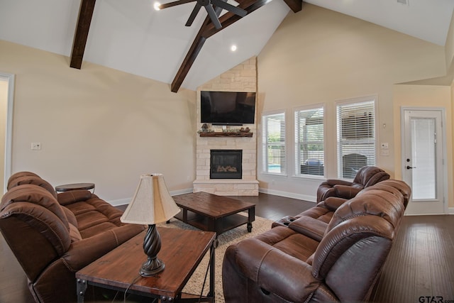 109 Nathan, Chandler, TX 75758 - living area with ceiling fan, beamed ceiling, high vaulted ceiling, dark wood-style flooring, and a stone fireplace