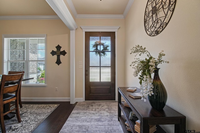 109 Nathan, Chandler, TX 75758 - foyer featuring crown molding, healthy amount of natural light, and dark wood-style flooring