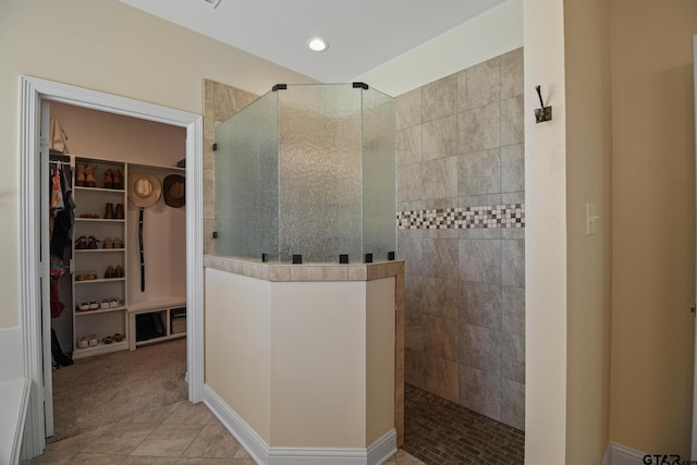 109 Nathan, Chandler, TX 75758 - full bath featuring a walk in shower, tile patterned floors, a walk in closet, and recessed lighting