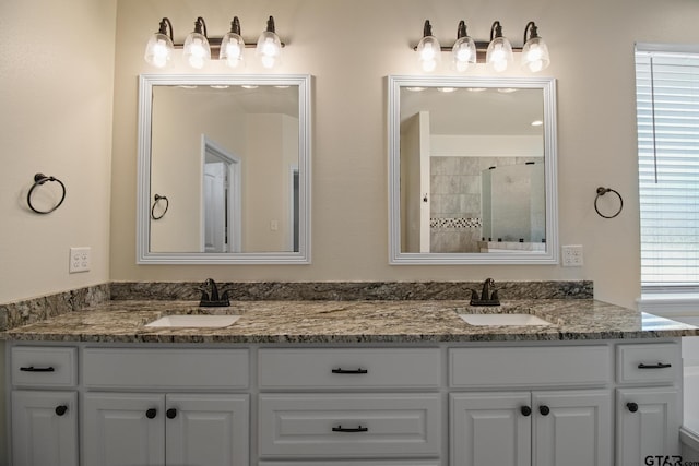 109 Nathan, Chandler, TX 75758 - full bathroom featuring double vanity, a tile shower, and plenty of natural light