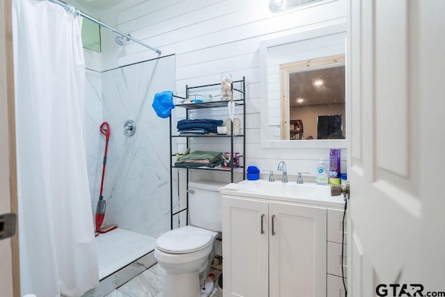 full bathroom with wooden walls, vanity, a shower stall, and toilet