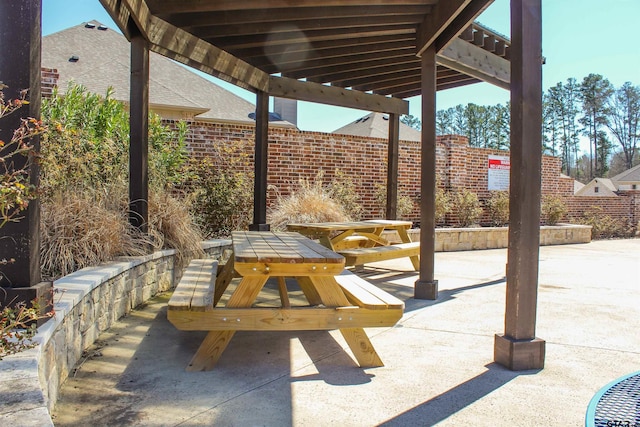 view of patio featuring fence and outdoor dining area