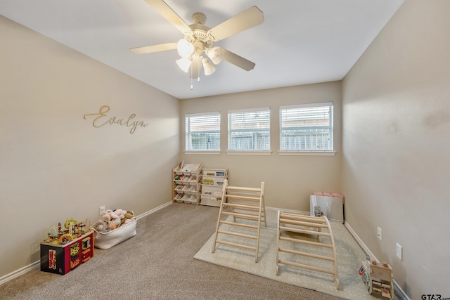 game room featuring carpet, baseboards, and ceiling fan